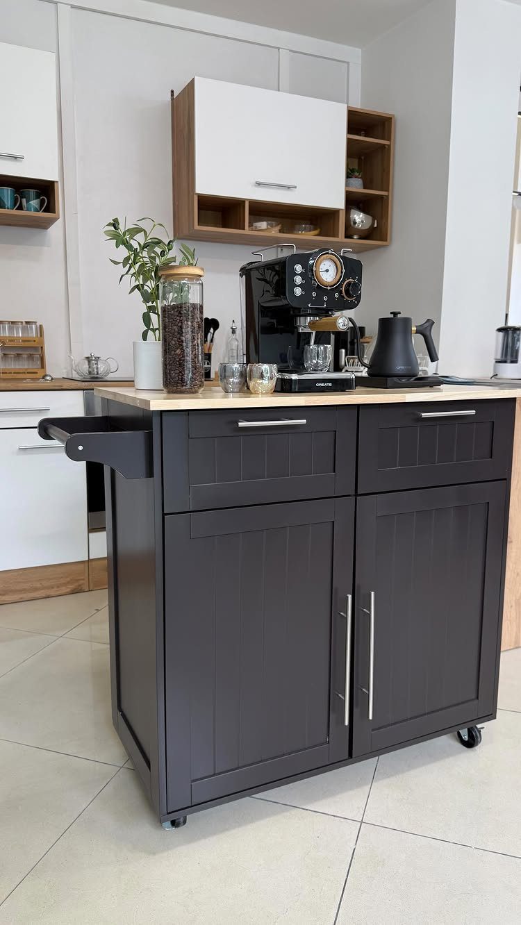 17 DIY Kitchen Island Ideas From Dressers to Live-Edge Slabs 7 A dark grey mobile kitchen island with a wooden top and small black wheels.